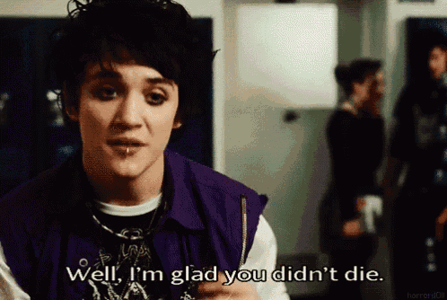 a man in a purple vest says well i 'm glad you didn 't die