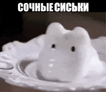 a white rabbit is on a white plate with a caption in a foreign language that says " сочные сиськи "