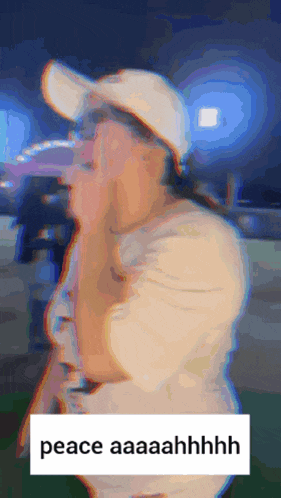 a blurry picture of a woman wearing a hat and a sign that says peace aaaaahhhh
