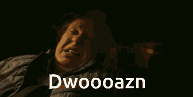 a man laying down with the word dwaooazn on the bottom right