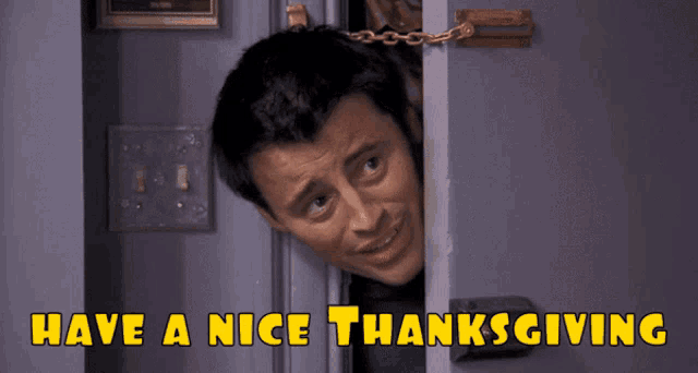 a picture of a man peeking out of a door with the words have a nice thanksgiving above him