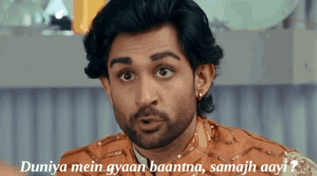 a man with the words duniya mein gyaan baantna samajh aayi above him