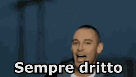 a man is pointing at the camera with the words sempre dritto written on the screen .