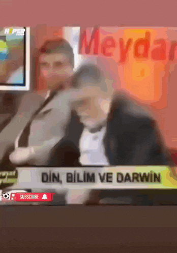a man in a suit and tie is being interviewed on a news channel