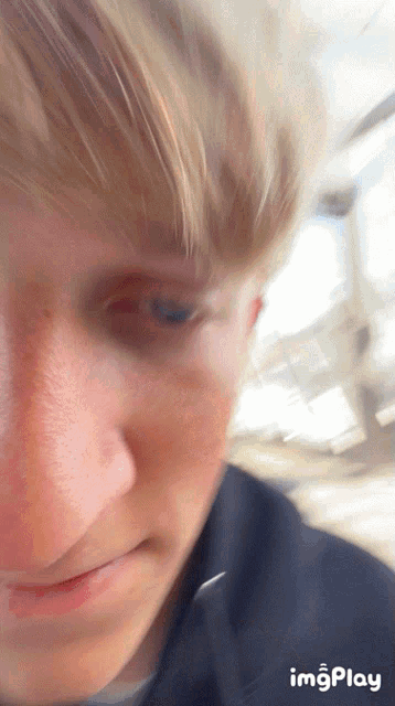 a close up of a person 's face with imgplay at the bottom right