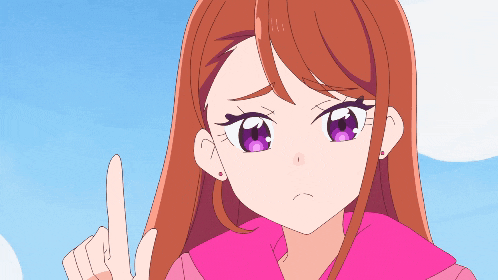 a girl with long brown hair and purple eyes is pointing upwards