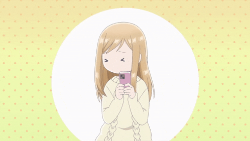 a girl in a white sweater is holding a cell phone