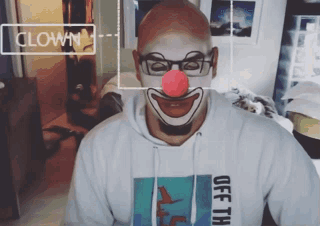 a man with a clown face painted on his face is wearing an off the wall shirt