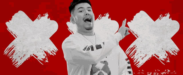 a man wearing a sweater that says xxx is dancing