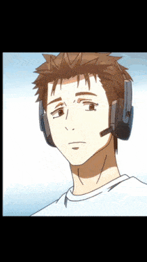 a man wearing headphones and a microphone looks at the camera