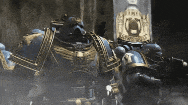 a group of space marines standing next to a sign that says " supreme kings "