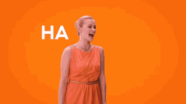 a woman in an orange dress is laughing in front of an orange background that says " ha "