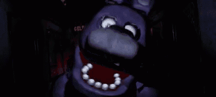 bonnie the bunny from five nights at freddy 's is standing in a dark room .