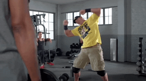 a man in a yellow shirt that says ' spongebob squarepants ' on it