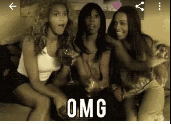 three women are sitting on a couch holding wine glasses and the word omg is on the bottom