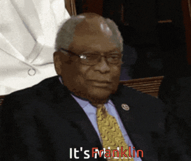 a man in a suit and tie says it 's franklin in red letters