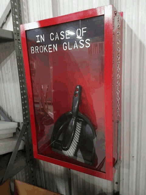 a red box that says " in case of broken glass " on it