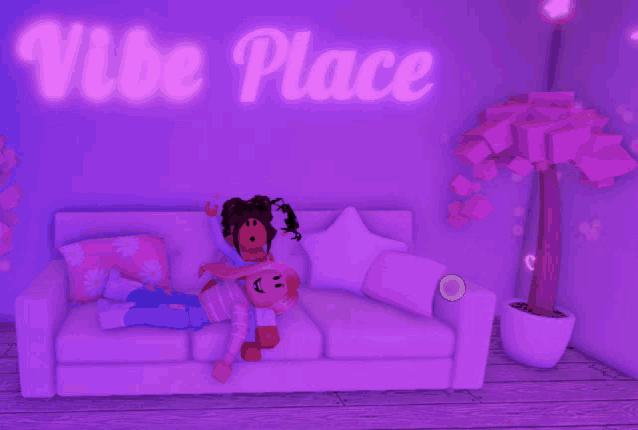 two girls laying on a couch under a vibe place neon sign