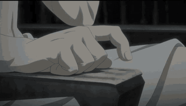 a black and white image of a person 's hands