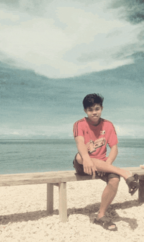 a young boy sits on a bench with the words good morning written above him