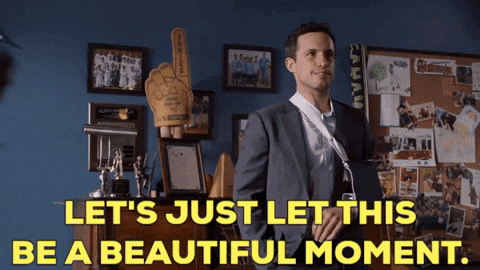 a man in a suit and tie says let 's just let this be a beautiful moment in yellow letters