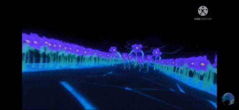 a bunch of purple flowers are growing in a field in the dark .