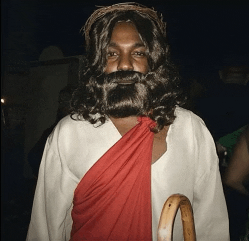 a man dressed as jesus with a beard and a crown of thorns