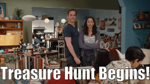 a man and a woman standing in a living room with the words treasure hunt begins