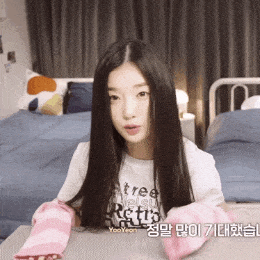 a girl wearing a t-shirt that says yooyeon