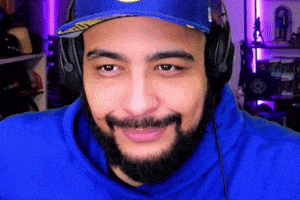 a man with a beard is wearing headphones and a hat
