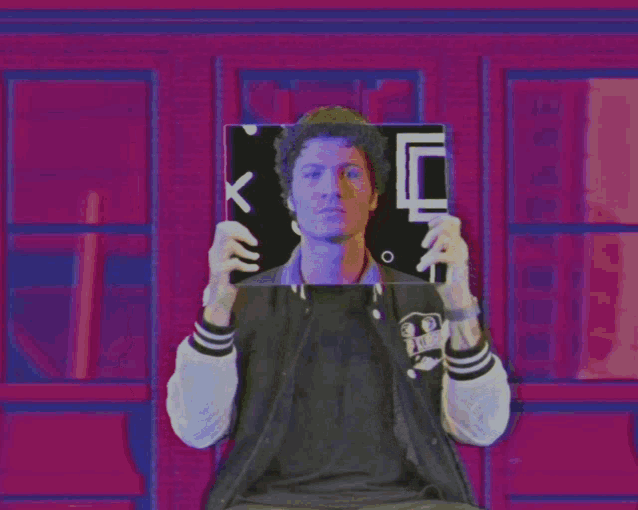 a man is holding a sign that says x + y