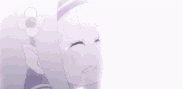 a girl with a flower in her hair crying