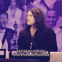 a man says serial murderer there is a difference in front of a crowd of people