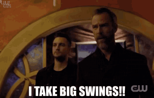 two men standing next to each other with the words " i take big swings " on the bottom