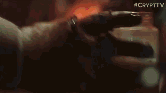 a close up of a person 's fist with smoke coming out of it
