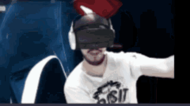 a man wearing a virtual reality headset is wearing a shirt that says ' ucsd ' on it