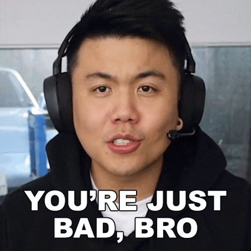 a man wearing headphones and a microphone is saying you 're just bad bro
