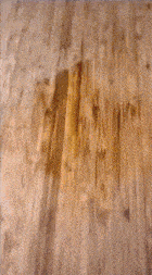 a blurred image of a piece of paper on a wooden surface