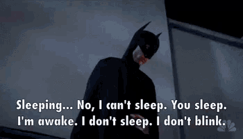 a batman laying down with the words sleeping no i can 't sleep