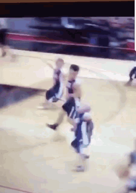 a basketball game is being played on a court