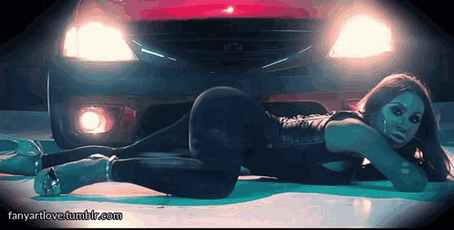 a woman is laying on the ground in front of a car and the website fanyartlove.tumblr.com is displayed