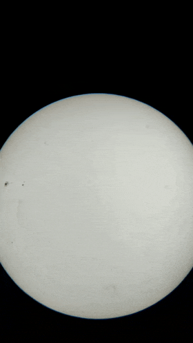 a black background with a white circle in the middle of it