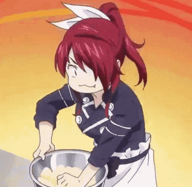 a girl with red hair is kneading something in a metal bowl .