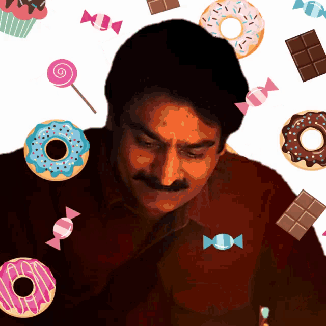 a man with a mustache is surrounded by donuts candy and cupcakes