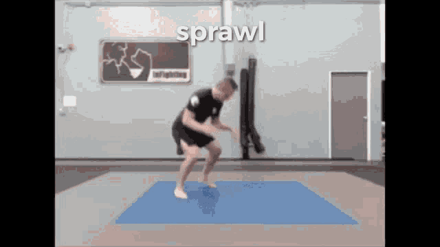 a man is jumping on a blue mat in a gym with the word sprawl on the bottom