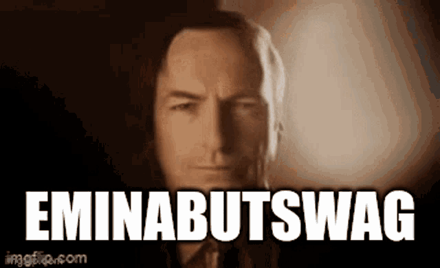 a close up of a man 's face with the words eminabutswag written on it