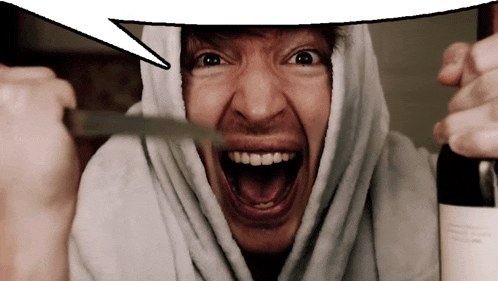 a man with his mouth open is holding a knife
