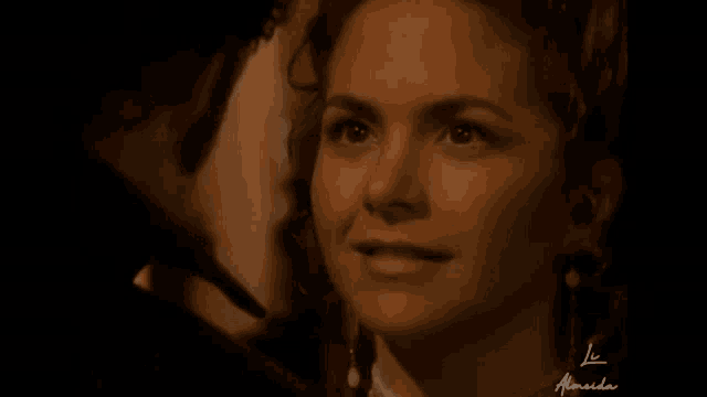 a close up of a woman 's face with the name almeida written on it