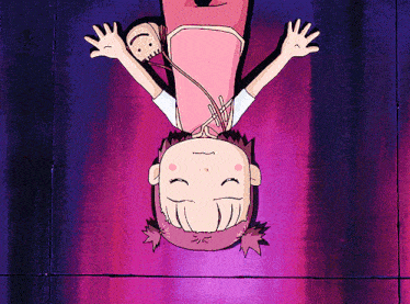 a girl in a pink dress is upside down