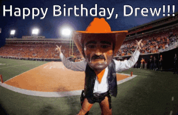 a mascot in a cowboy outfit is on a field with the words " happy birthday drew " above him